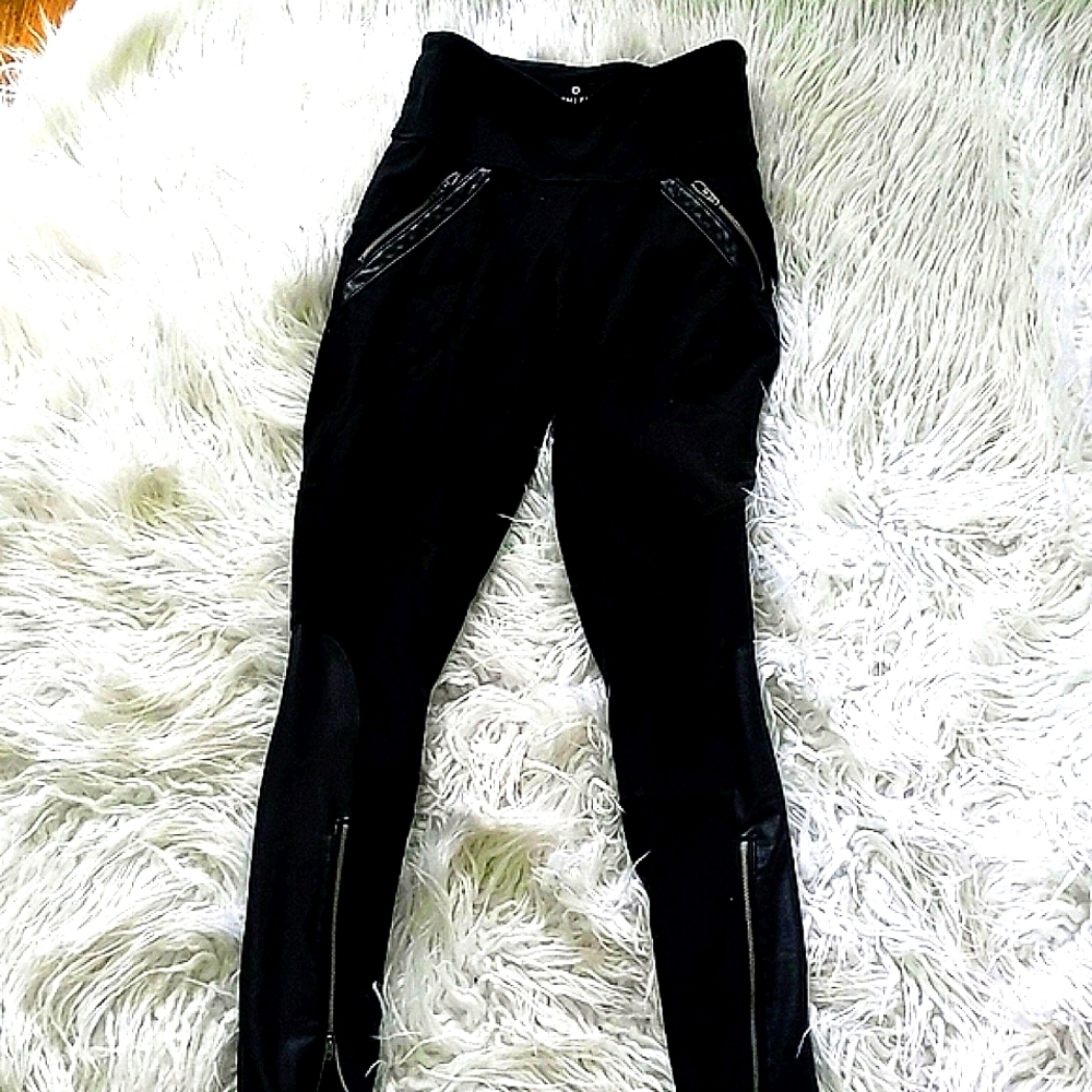 Athleta black leggings with zippers and faux leather on hips and calf